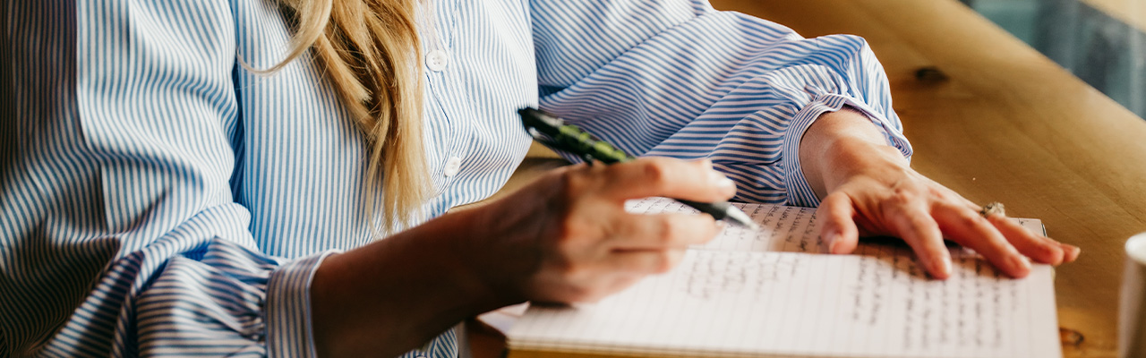 Wren writing at a desk